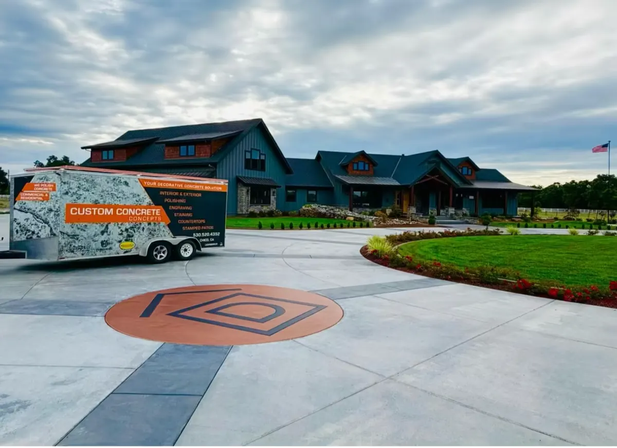 Stamped concrete driveway in front of a custom home